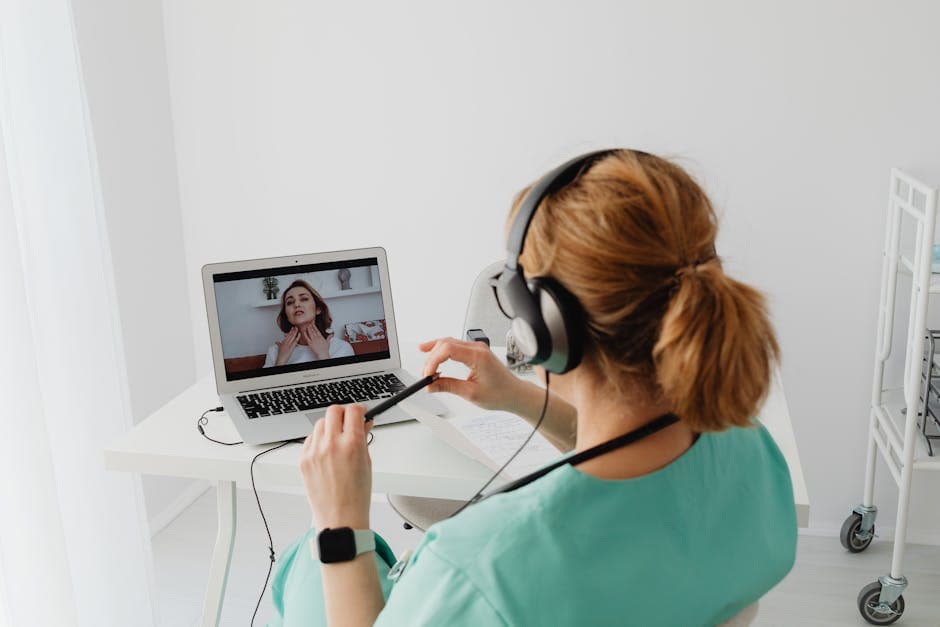 Telehealth video consultation on laptop screen